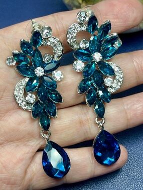 Silver tone blue/clear crystal floral dangle post earrings